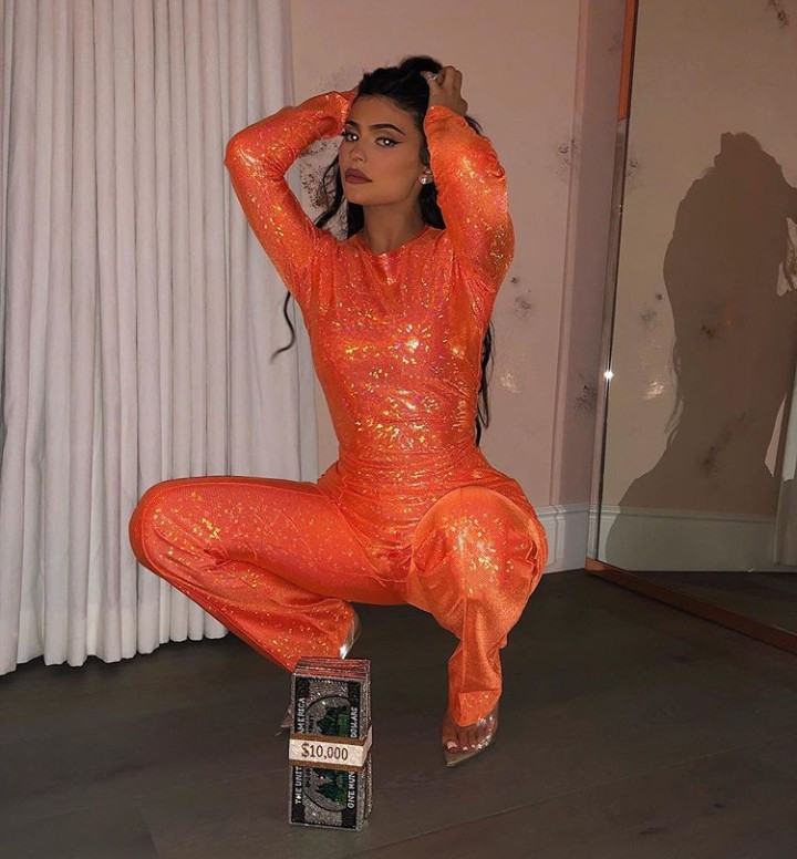 kylie jenner poses in orange jumpsuit to celebrate the start of october following travis scott split 2