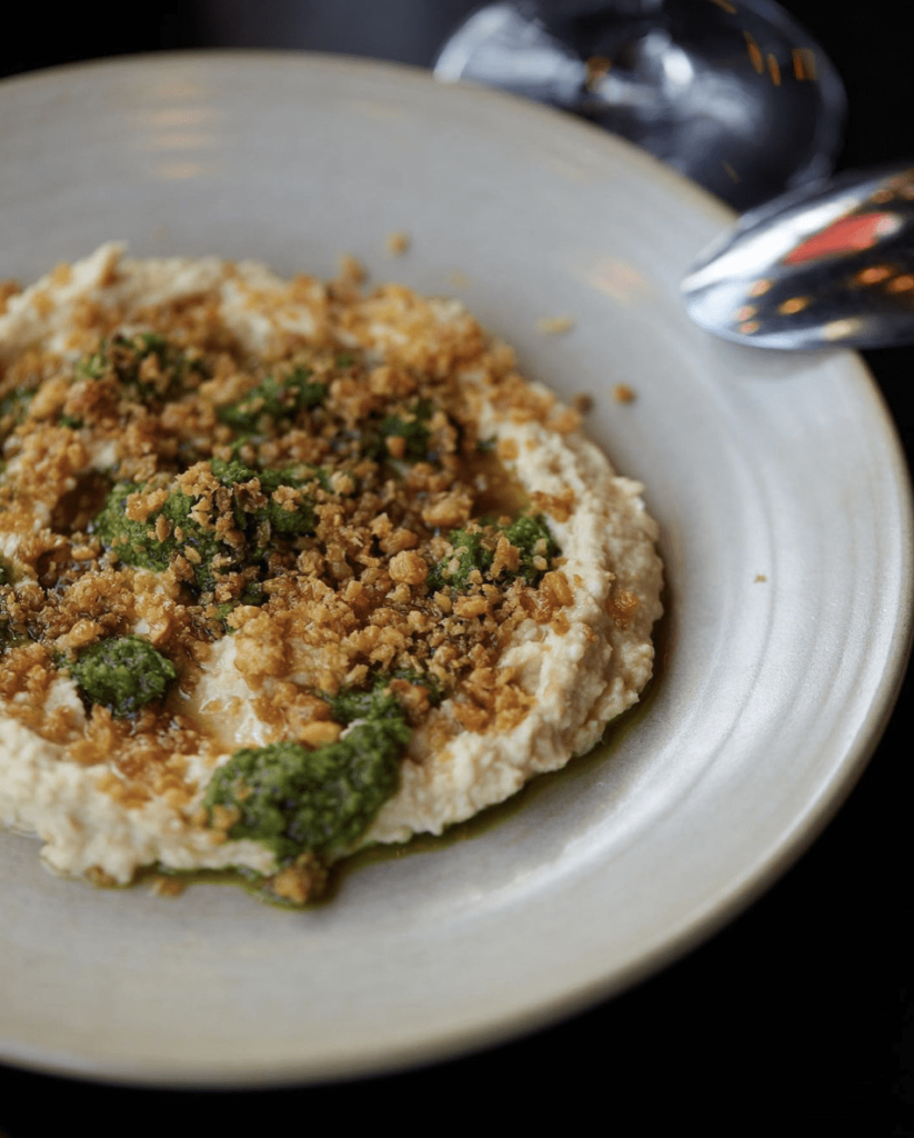 Signature starter Hummus parsley vinaigrette chickpeas