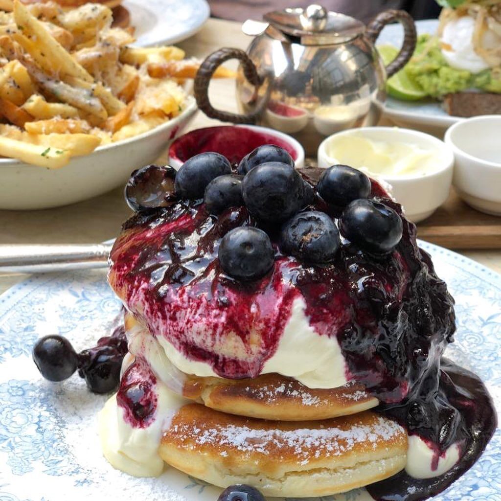 Buttermilk pancakes with blueberries crème fraîche and maple syrup